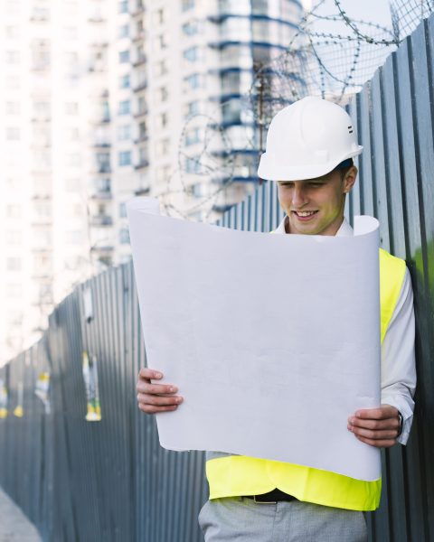 medium-shot-young-man-with-safety-vest-helmet (2)